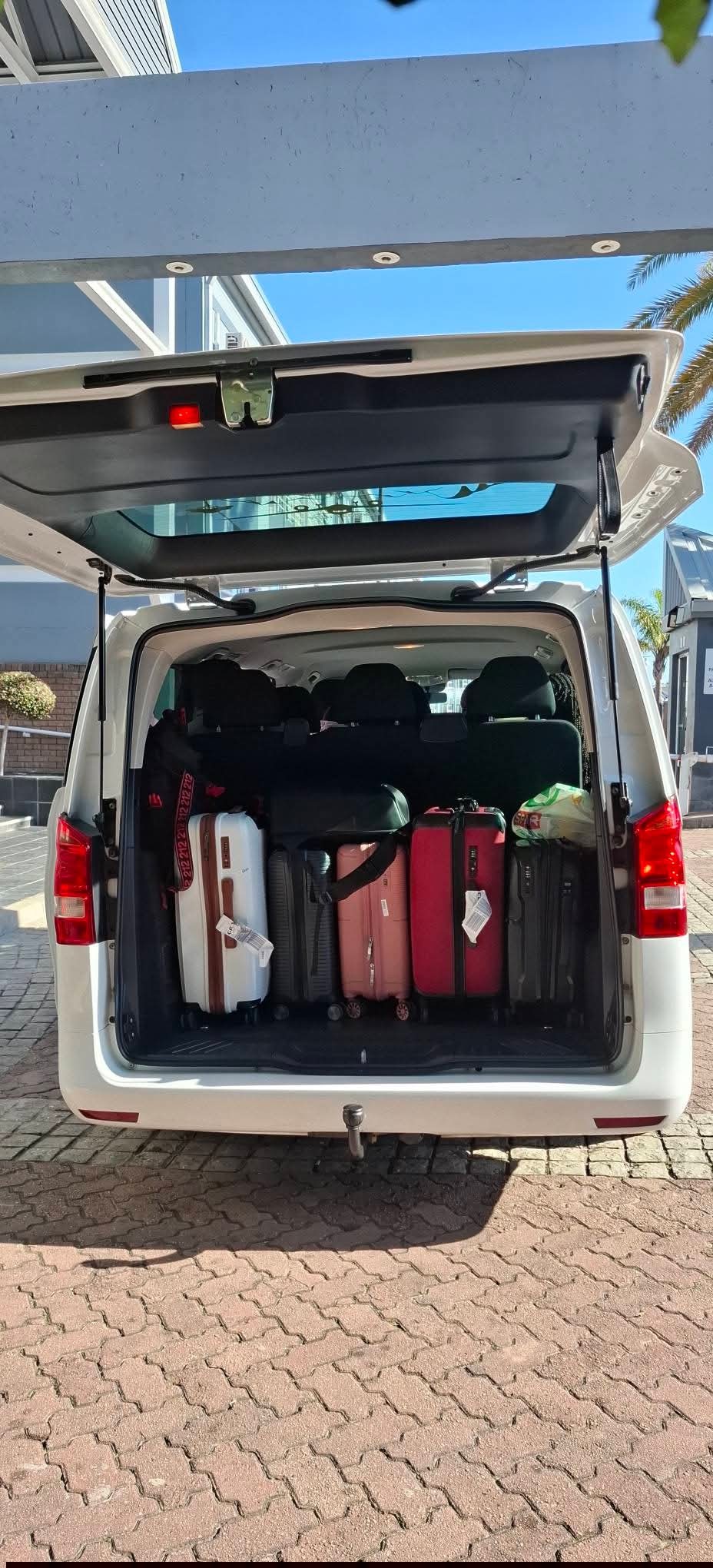 Mercedes Vito boot fully loaded with passenger luggage